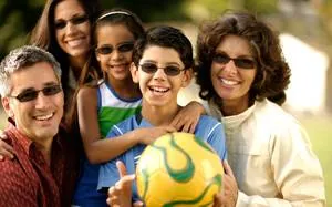 Family outdoors wearing Transitions lenses